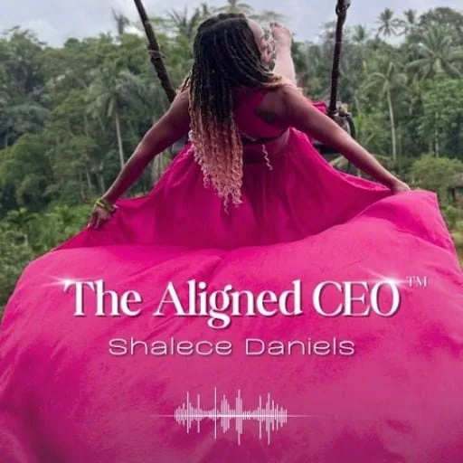 A woman with arms outstretched in a beautiful pink gown.