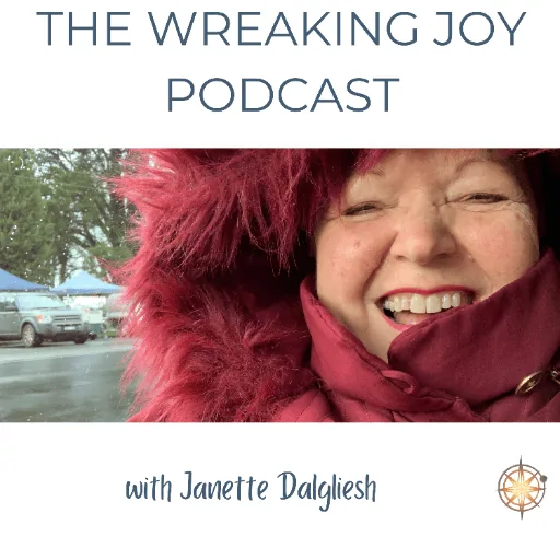 A smiling woman on a warm coat with hood.